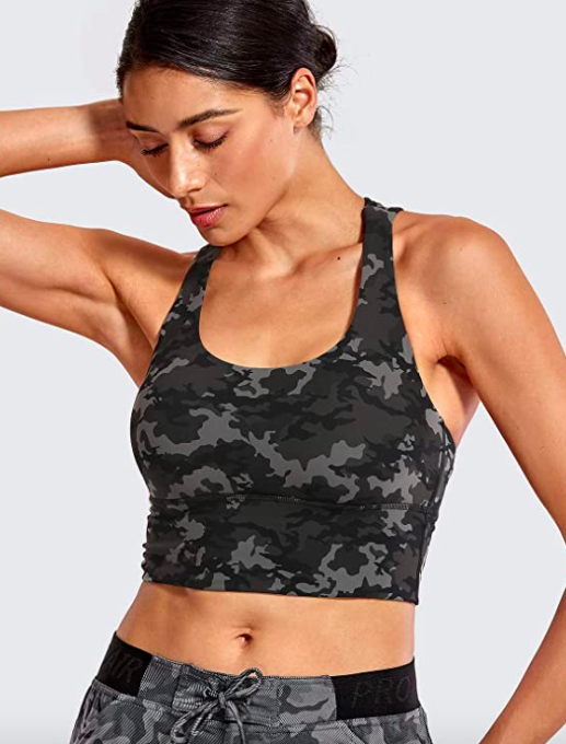 Model showcases a camo-print gray and black crop top featuring removable pads