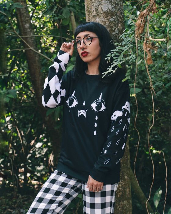 Artist Sonia Lazo demonstrates the sweater's artistic edge in real-world styling
