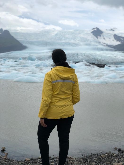The reviewer is wearing the same jacket while strolling along a shoreline in Ireland.