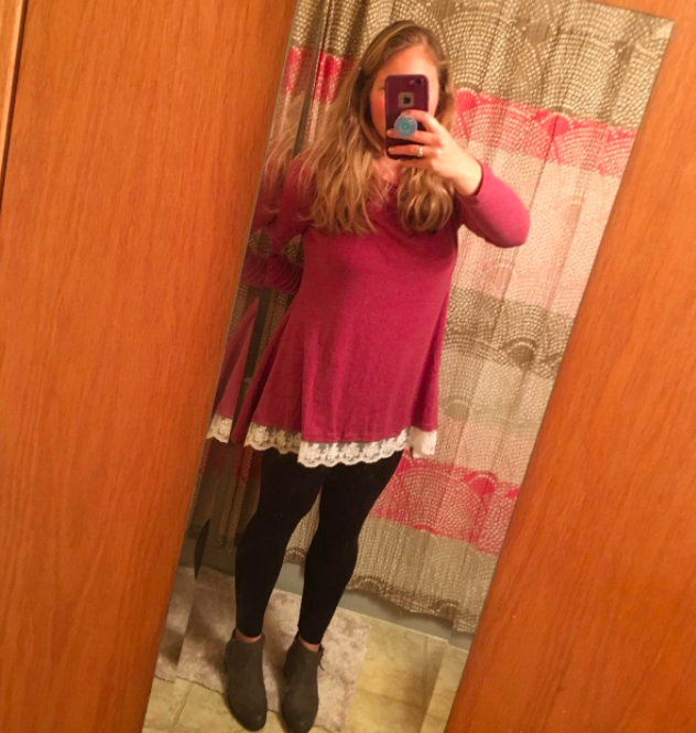 A style enthusiast styled in the crimson statement top