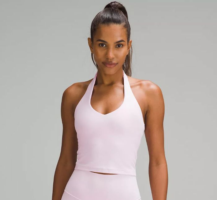 A model wearing a rose pink halter top.