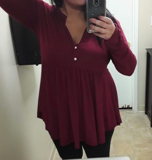 A fashion enthusiast pairs the top with wine red jeans