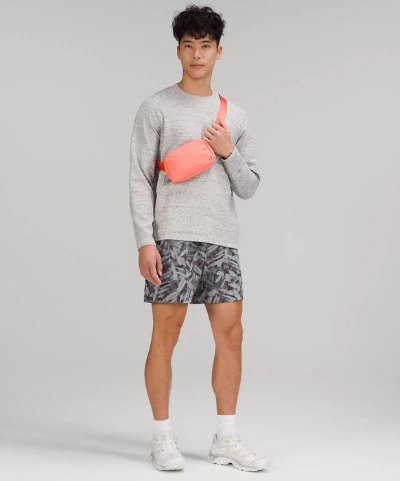 A model rocking a pink fanny pack.