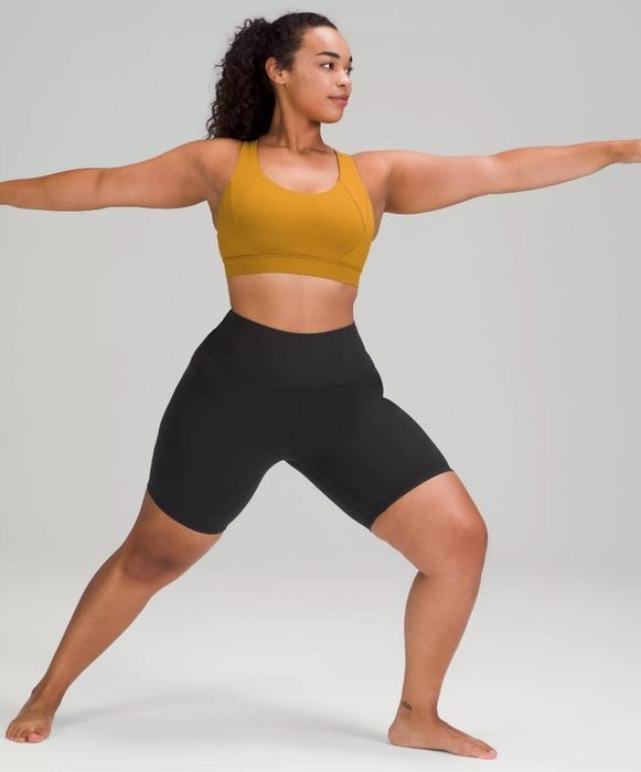 A pair of high-rise, above-the-knee black yoga shorts.