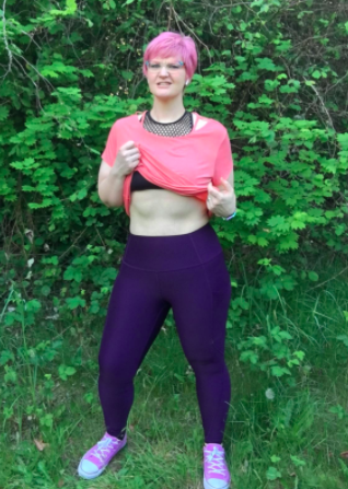 Reviewer showcases the same style of leggings in a dark purple shade