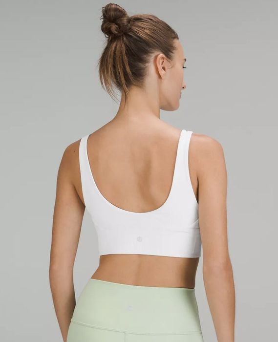 A white ribbed long-line sports bra viewed from the back
