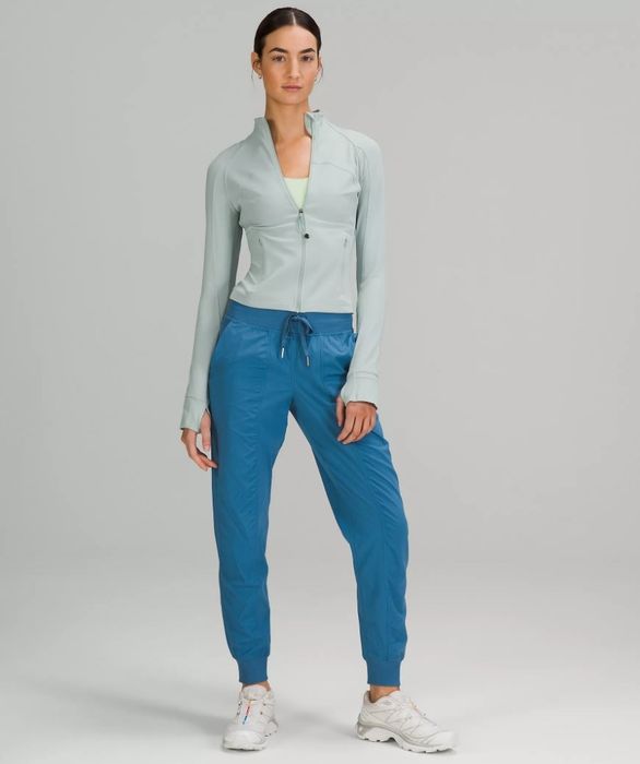 A model showcasing a pair of light blue mid-rise joggers.