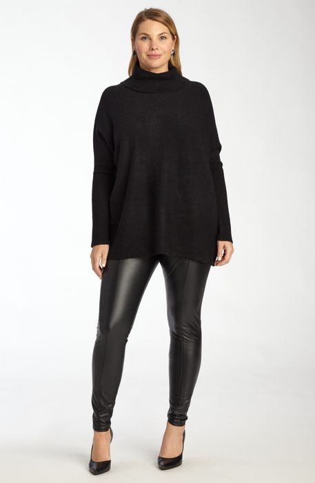 Editorial proof of the jet-black iteration's versatility against matte leggings