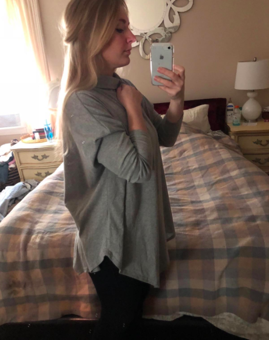 The slate gray top styled with minimalist precision by a style enthusiast