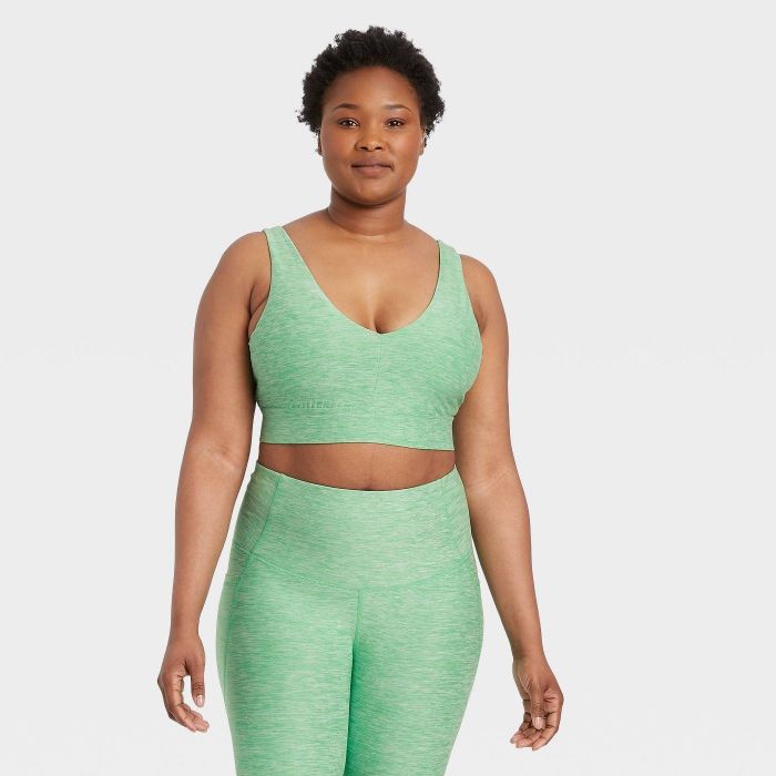 The sports bra featured in a vibrant green color
