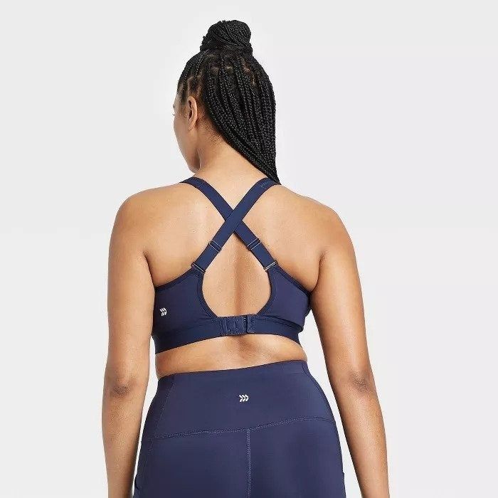 Back view highlighting the bra’s criss-cross straps and hook closure