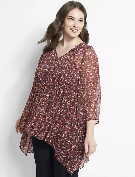 Stylist demonstrates a crimson floral babydoll top effortlessly paired with classic black leggings