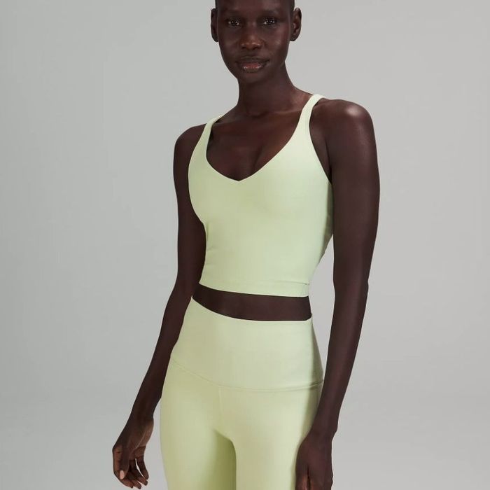 A model sporting a mint-colored athletic tank top.