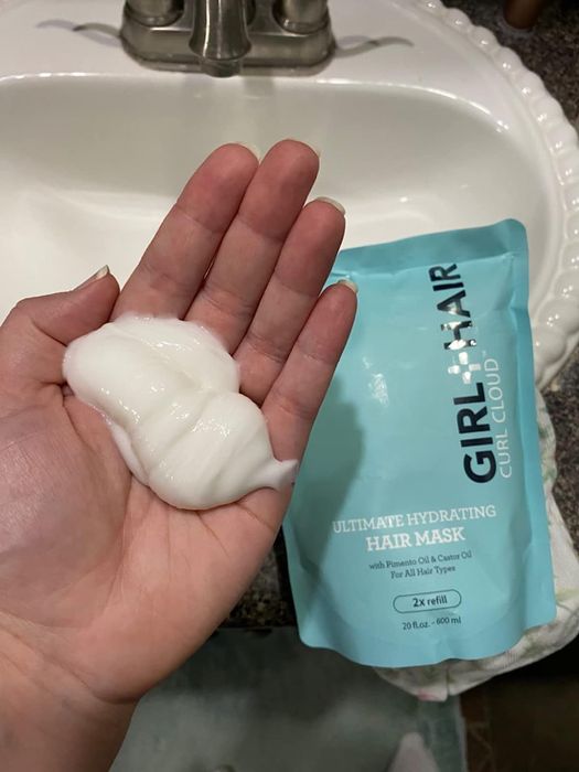 A reviewer's photo of the product pouch and a portion of the mask in their hand.