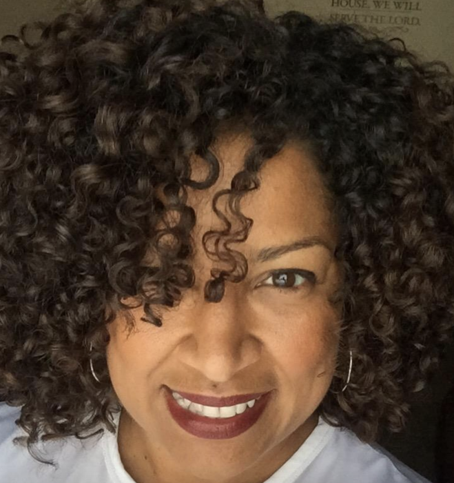 reviewer showcasing beautifully defined curls