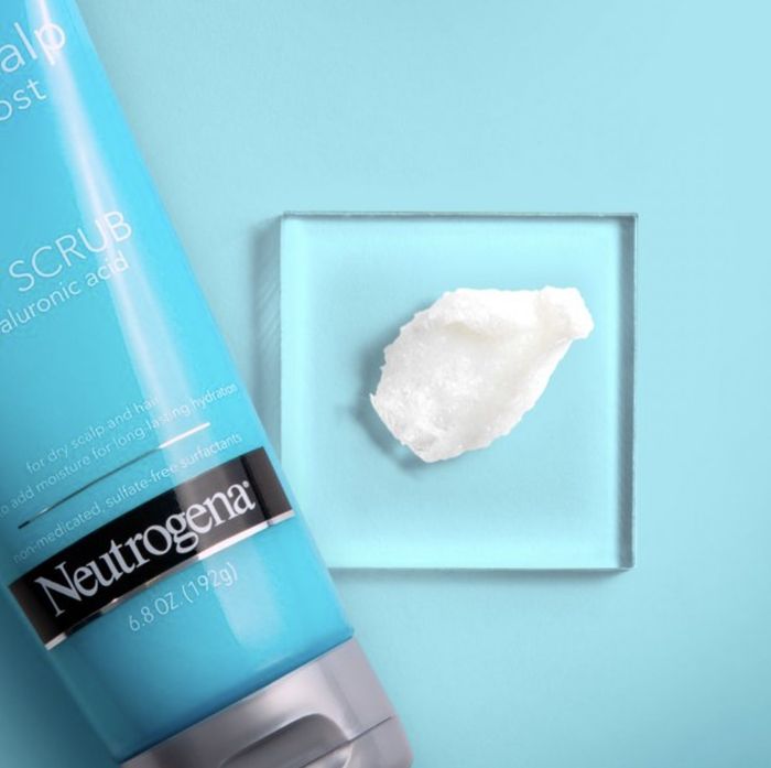 A tube of scalp scrub with a small amount squeezed out.