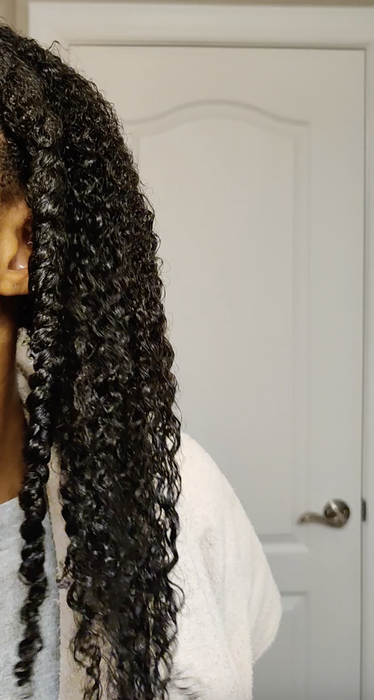 Showing off defined, shiny curls after the gel was applied.
