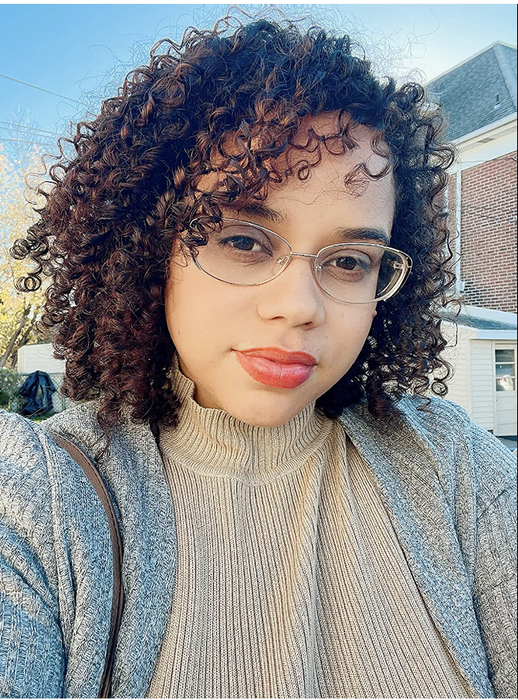 A reviewer's hair showcasing more defined curls after using the mask