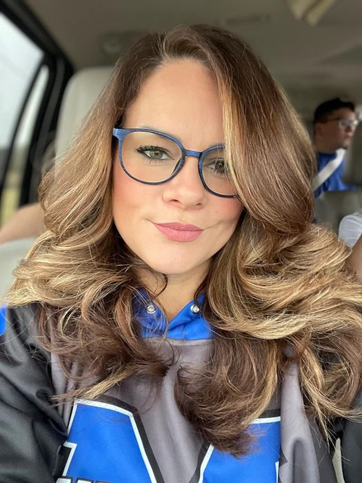 reviewer’s beautifully curled hair after using the blow dryer