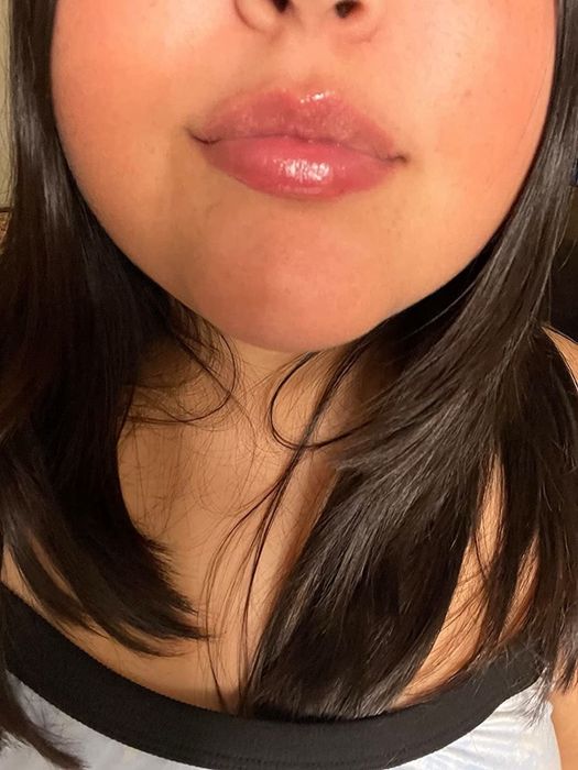 Reviewer applying the lip gloss