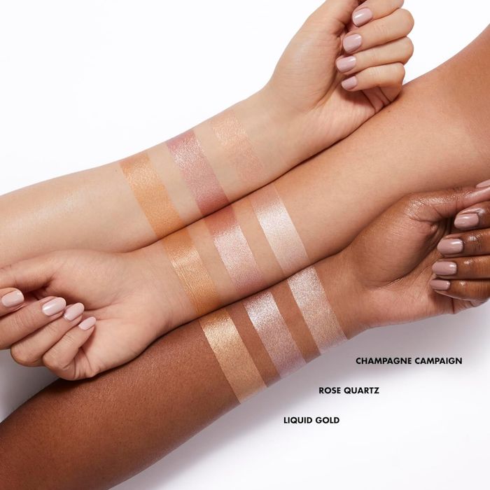 Swatches of the three available shades on arms of various skin tones.
