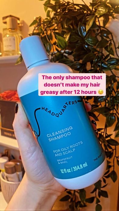 A hand holding the shampoo with text 