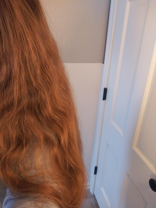 Reviewer with frizzy, long hair