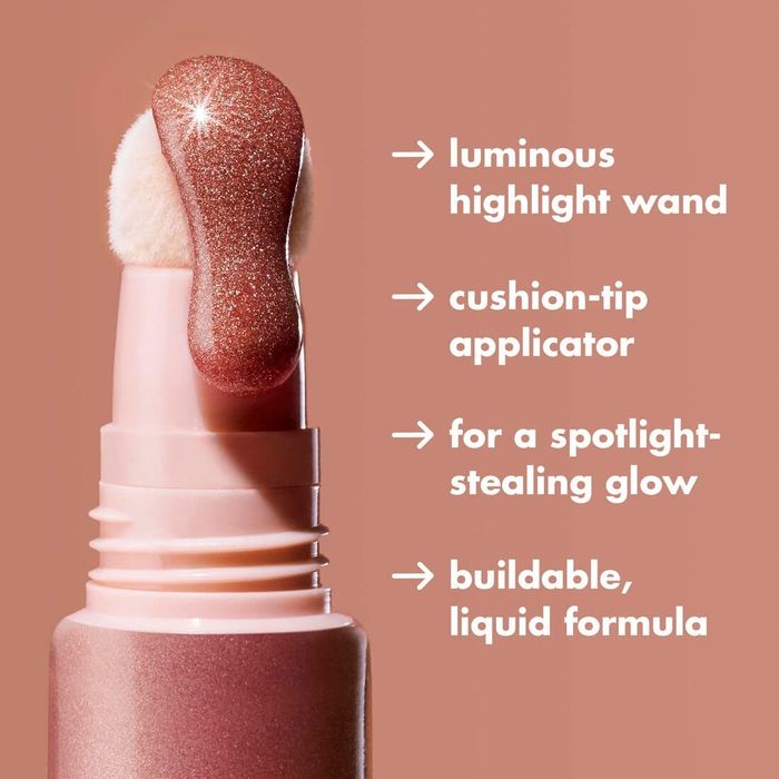 The rose quartz shade flowing from the tip of the applicator wand.