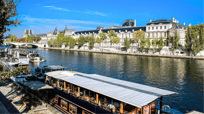 Enjoy the lively atmosphere at outdoor bars along the Seine