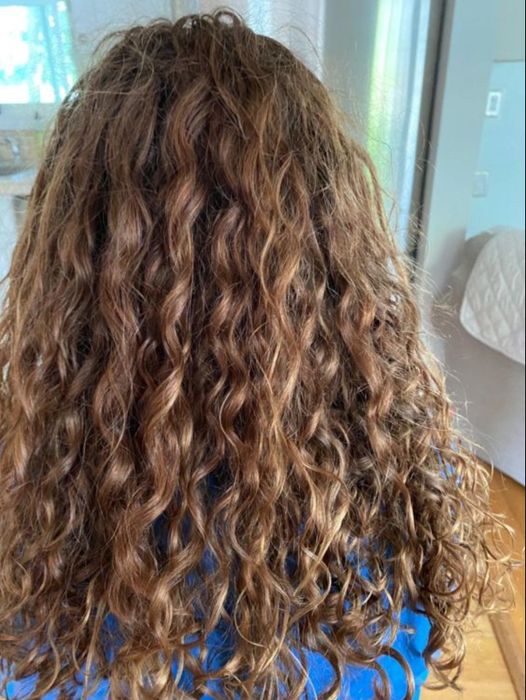 The back view of a reviewer’s head after using the product