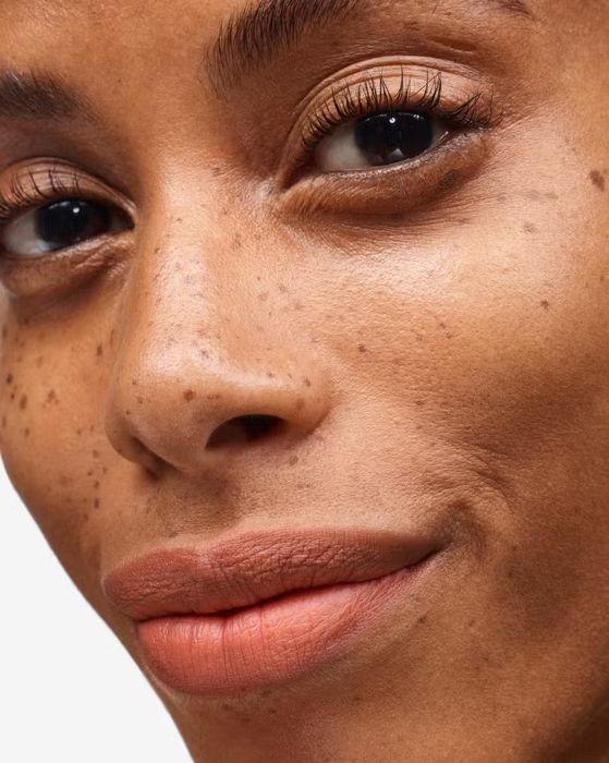 Model showcasing the smooth matte lipstick look