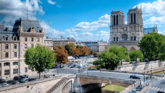 The view from Les Rives de Notre-Dame hotel overlooks Notre-Dame Cathedral and the Seine River