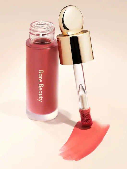 Rare Beauty blush in the shade Believe, displayed in its elegant bottle.