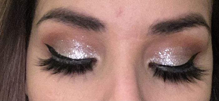 A reviewer rocking the dazzling glitter eyeshadow