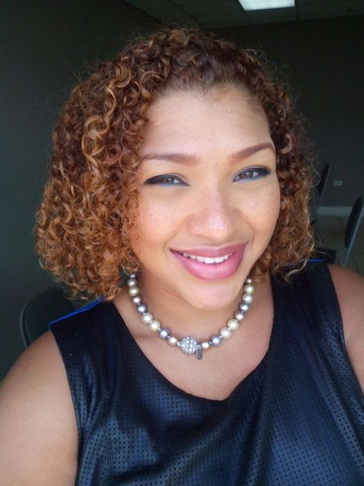 A reviewer with curly, coiled hair.