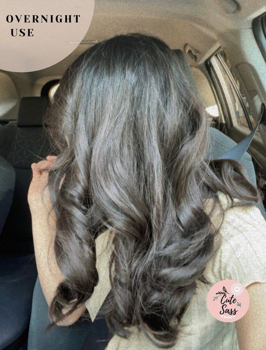 A model with curly hair showcasing the text: 