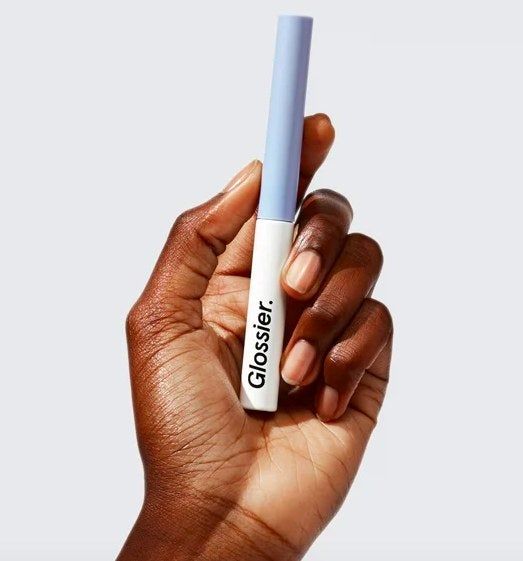 Model showcasing the lid tint in hand