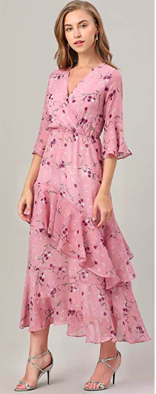 A model donning the dress in a soft pink shade.