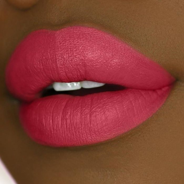 Lips adorned in a berry tone.