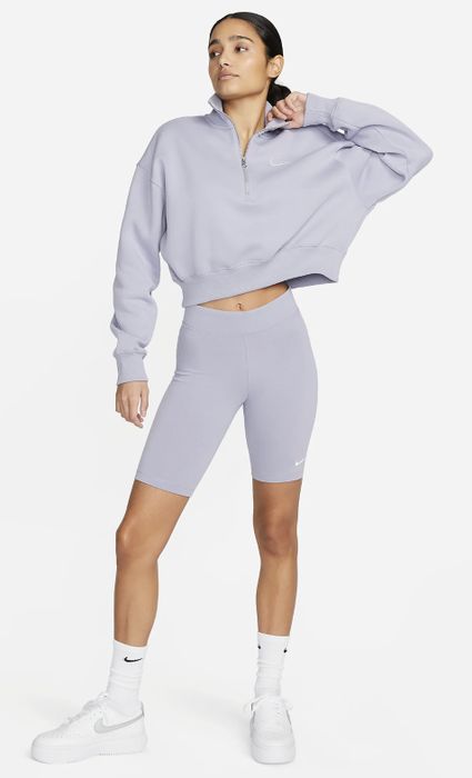 A model showcasing light purple shorts paired with a matching cropped sweatshirt.