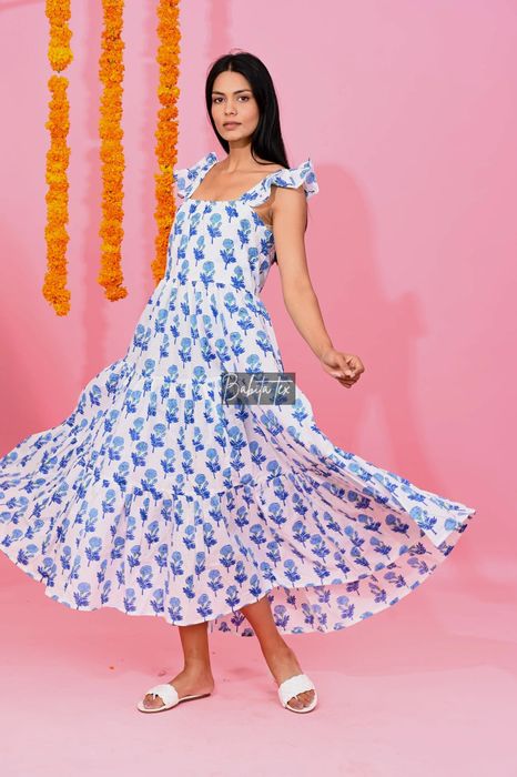 A model is seen in a floral maxi dress.
