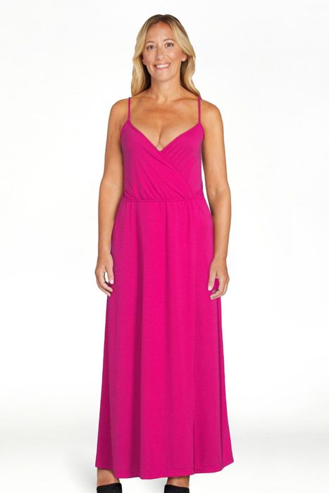 A model dressed in the vibrant magenta dress