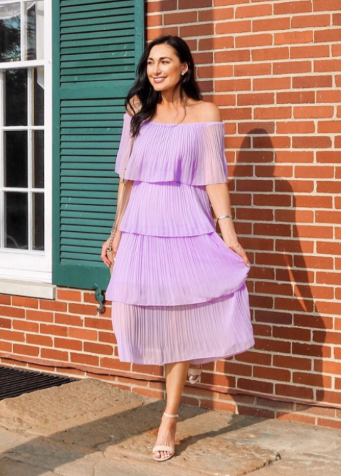 Reviewer wearing the maxi four-tier dress