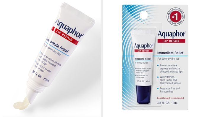A tube of Aquaphor Lip Repair ointment next to its packaging