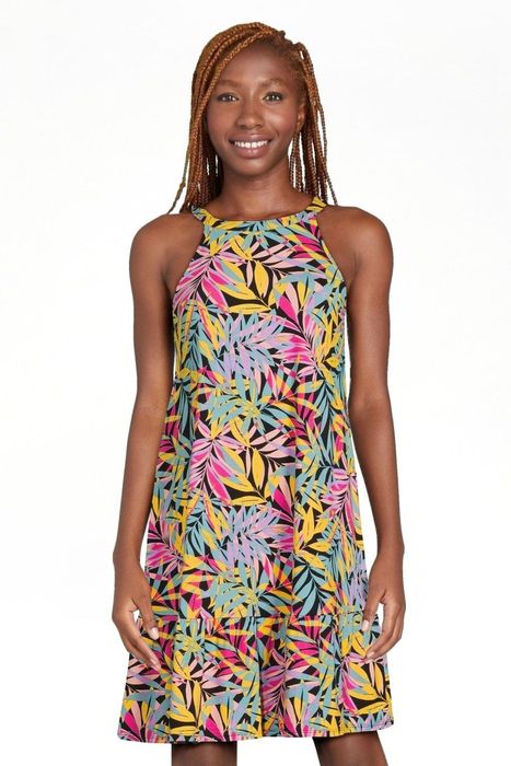 A model showcasing the vibrant tropical print dress