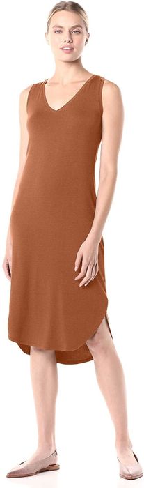 A model is seen wearing the dress in a rich brown color.