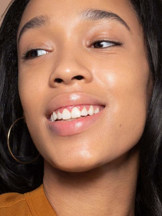 Model showing off her dewy, smooth complexion.