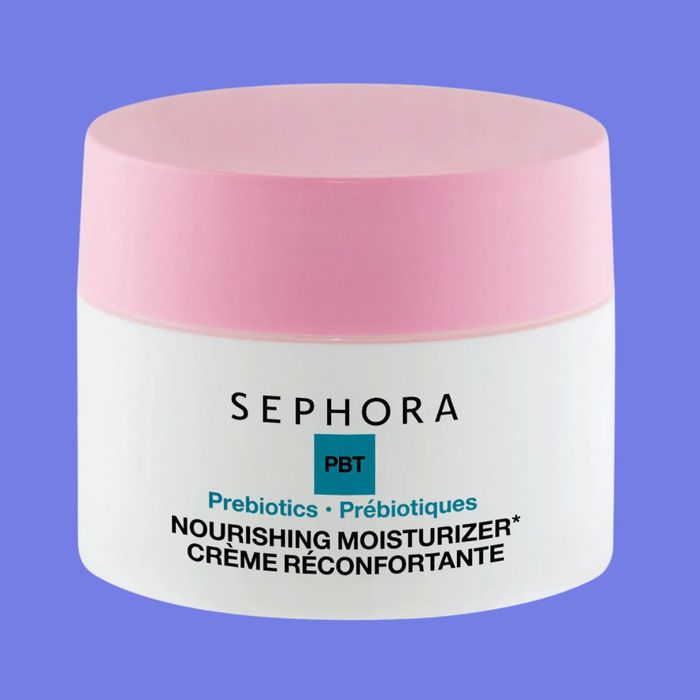 A jar of Sephora PBT Nourishing Moisturizer featuring prebiotics and bilingual labels in English and French, set against a light blue background.