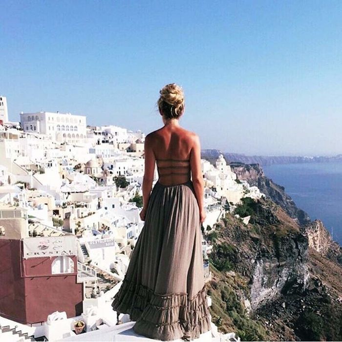 Back view of the open-back maxi dress.