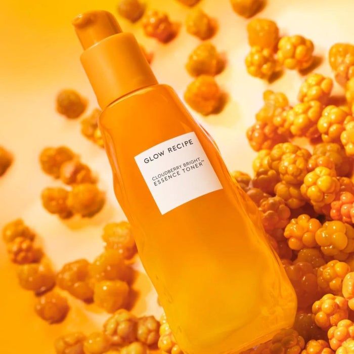 Glow Recipe Cloudberry Bright Essence Toner bottle, showcased alongside cloudberries